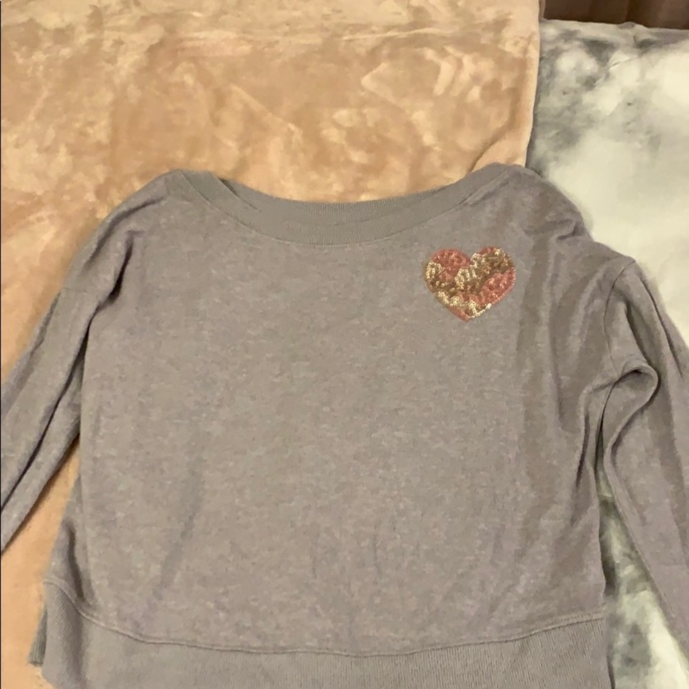 gray/purple shirt.